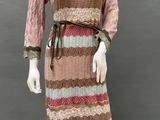 an image of a mannequin wearing a pink and brown striped dress