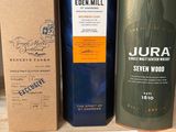 two bottles of jura and seven wood on a shelf in a store