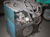 a machine that is sitting on the ground in the garage