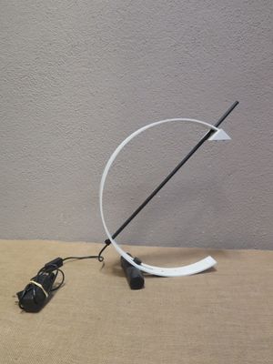 a lamp that is sitting on a table next to a charger