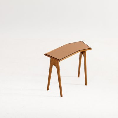 an image of a small wooden table with a glass top on a white background