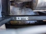 a close up of a metal object with a sign on it