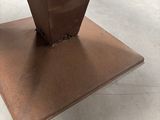 an image of a piece of metal that has been placed on top of a table