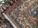 an image of a close up of a rug on a wooden floor