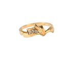 a close up of a gold ring with a diamond on it