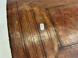 a close up of a piece of wood with a tag on it