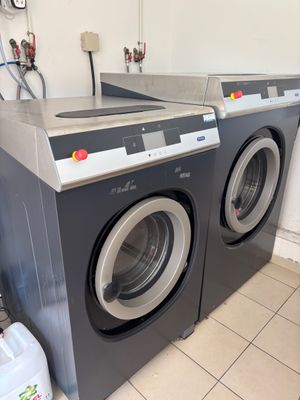 a photo of a washer and dryer in a laundry room