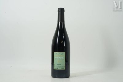 a bottle of wine that is sitting on a table