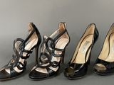 three pairs of black high heel shoes are lined up against a gray background