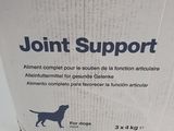 the box of joint support for dogs is sitting on the table