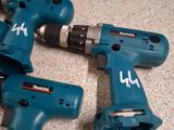 three electric tools that are sitting on a counter