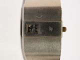 a close up of a wrist watch on a white surface