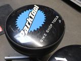 a black stool with a blue sticker on it