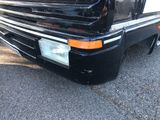 a close up of the front end of a black truck
