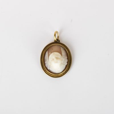 a gold locke with a picture of a woman in a white dress