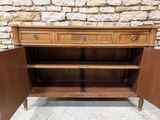 a wooden cabinet with two drawers and a door open