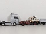 a lot of toy trucks that are lined up together