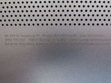 a close up of a metal plate with holes on it