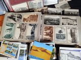 a lot of old postcards on the table