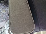 a suitcase that is sitting next to a laptop computer