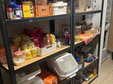many shelves that have food on them in the kitchen