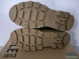 the soles of a pair of shoes are shown on top of a cardboard box