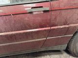 a red car that is parked in a garage