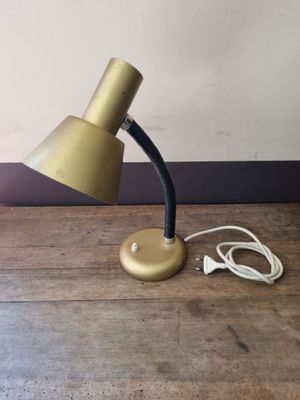 a lamp that is sitting on a table next to a charger