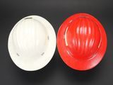 a hard hat and a hard hat on a black background
