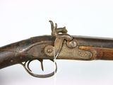 an old gun with a silver ring on it ' s side