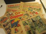 a lot of old comic books on a table