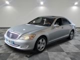 a picture of a silver mercedes s - class in a showroom