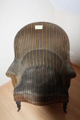 a chair that is sitting on a hard wood floor