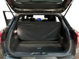 the back of a car with its trunk open and the back seats folded down