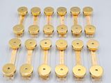 a close up of a bunch of brass knobs on a white surface