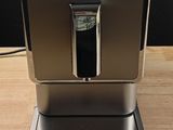 an image of a coffee machine on a wooden table