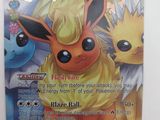 gros plan d'une carte pokemon sur une surface blanche