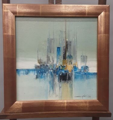 une peinture à l'huile représentant un paysage urbain, encadrée et posée sur un chevalet