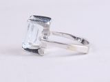 an image of a silver ring with an aquamarine stone in it