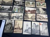 a lot of old postcards that are on a table