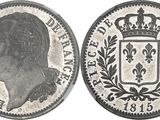 a close up of a coin with a crown on top of it