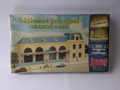 an image of a box with a model of a building on it