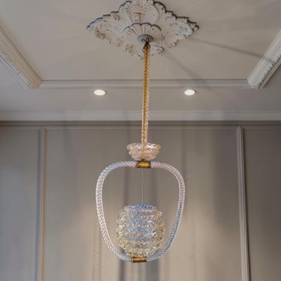 a chandelier hanging from the ceiling in a room