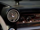 a close up of a car dashboard with a clock on it