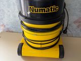 a close up of a yellow and black vacuum on a table