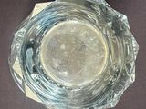 a glass of water sitting on top of a table