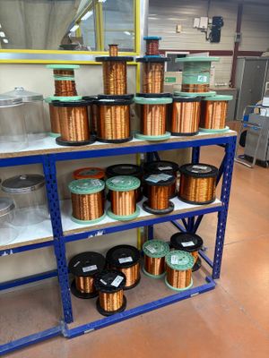 many different types of wires on the shelves in the store