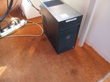 a desktop computer sitting on the floor next to a bike