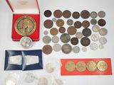 a lot of coins that are in a red box
