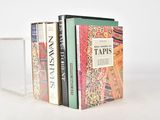 three books that are stacked on top of each other